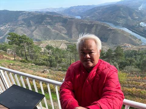 Person with a scenic valley in upside-down view.