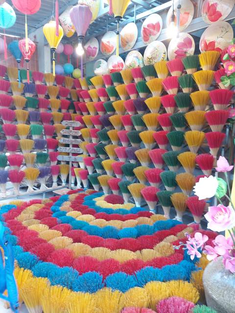       Colorful incense sticks on display.
  
