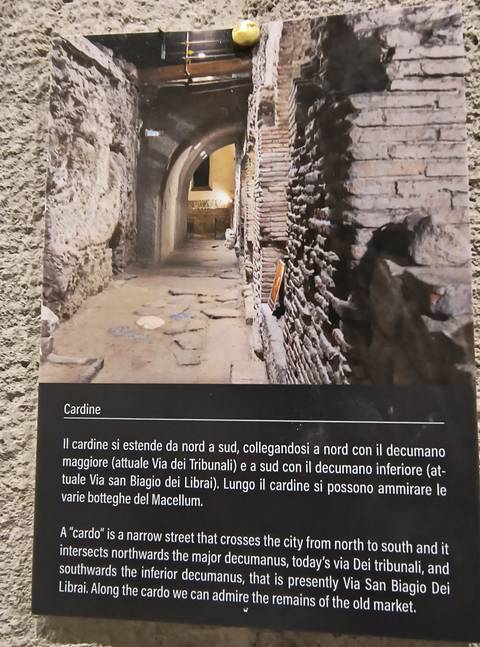 Sign with text description and ancient ruins.