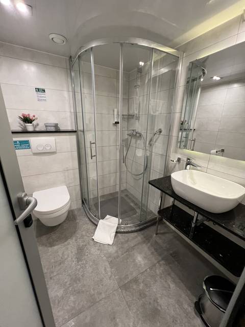 Bathroom interior with shower and sink.