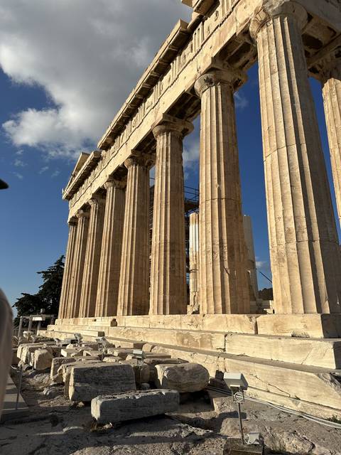       Ancient columns under a clear sky.
  