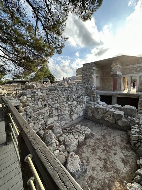       Stone ruins with partially cloudy sky.
  