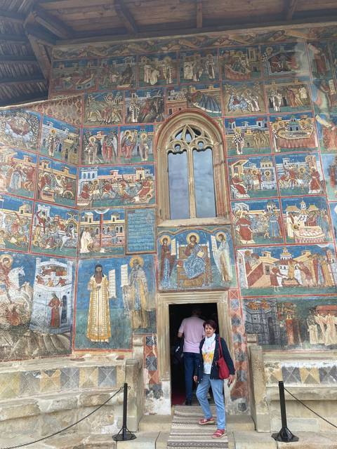 Colorful frescoes on the walls of a building.