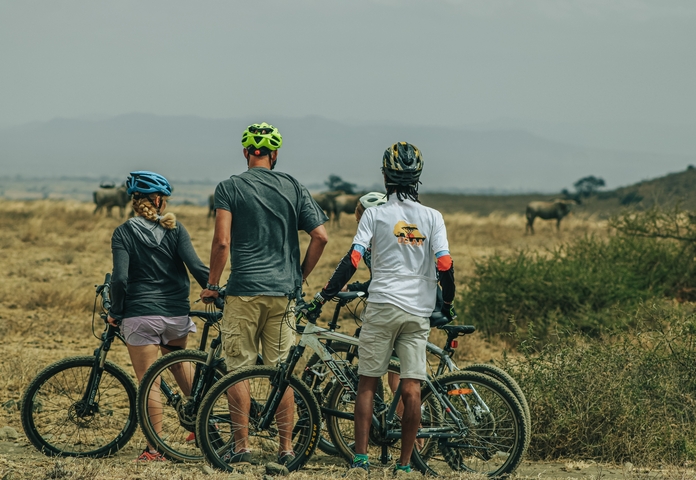 Cyclists observing wildlife on the plain