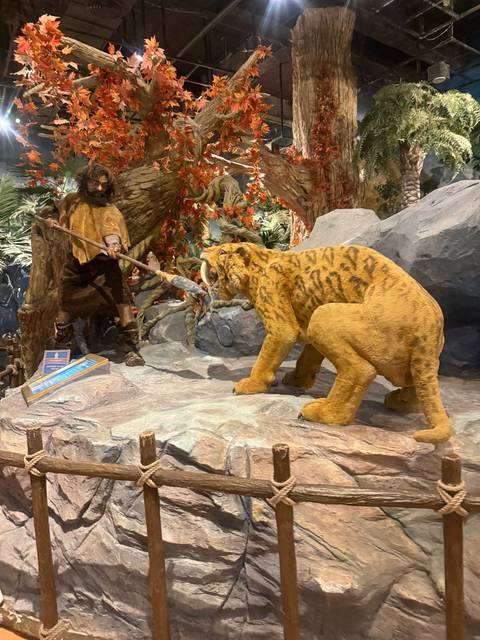 Diorama or model featuring a prehistoric scene.