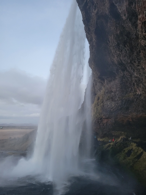 Large waterfall viewed from behind.