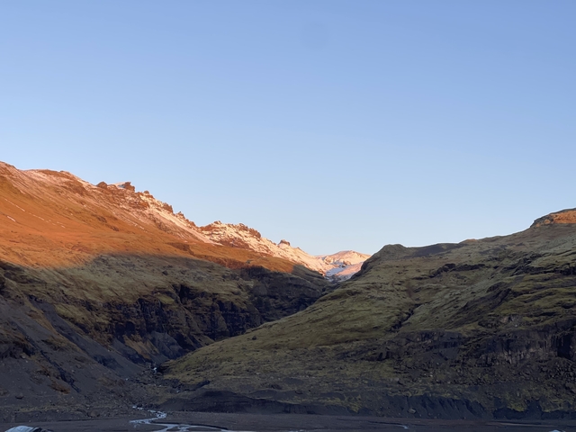 Mountain valley during sunset.