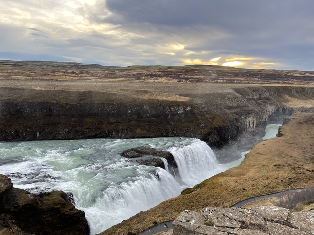       Wide view of a double-tiered waterfall.
  