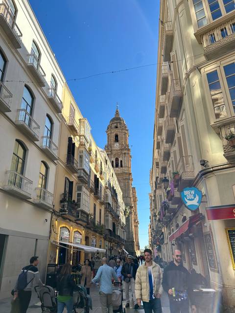       Street view with a mix of modern and historical buildings.
  
