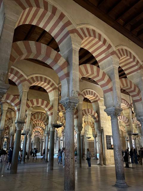 Interior of a historic building with arches and columns.