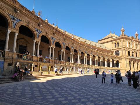 Extensive plaza with a large historic building.