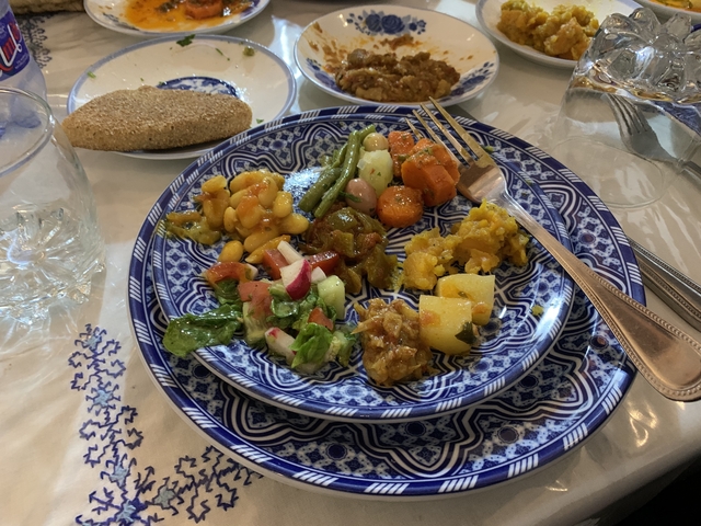 Mixed Moroccan dishes on a decorative plate.