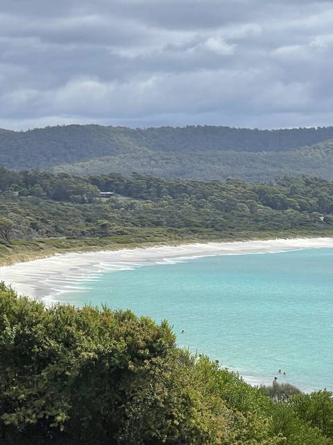       Coastal landscape with turquoise waters.
  