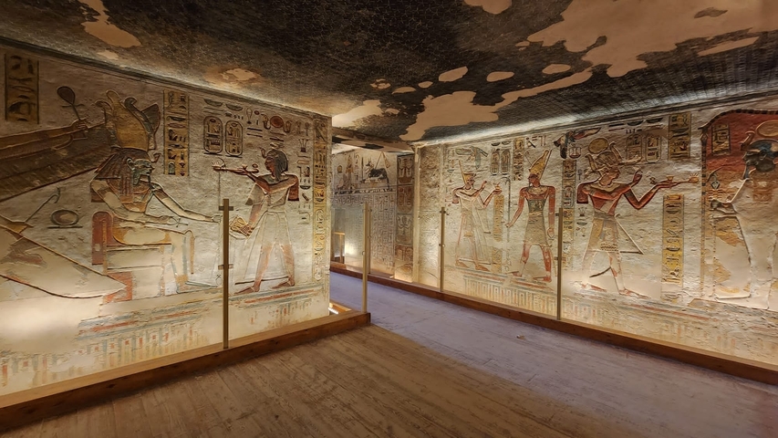       Egyptian wall fresco with intricate carvings.
  