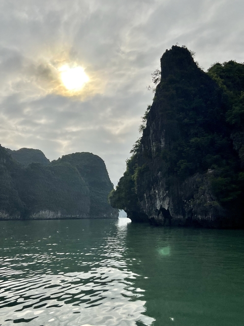       Dramatic limestone cliffs with a narrow passage over the sea.
  