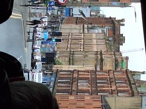       Street view with historic buildings and traffic lights.
  