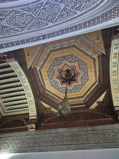       Intricately decorated ceiling in traditional Moroccan style.
  