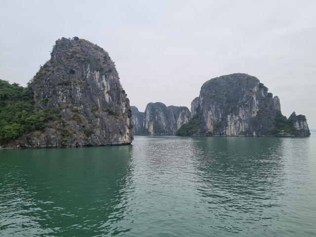       Scenic view of limestone islands in Halong Bay.
  