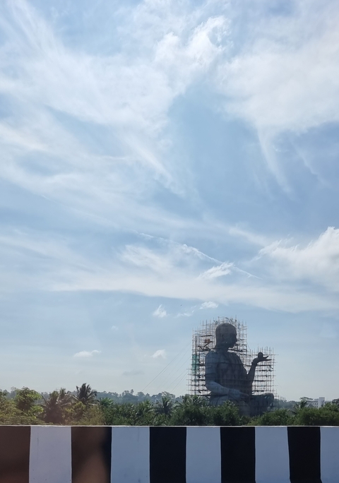       Construction scaffolding around a large statue.
  