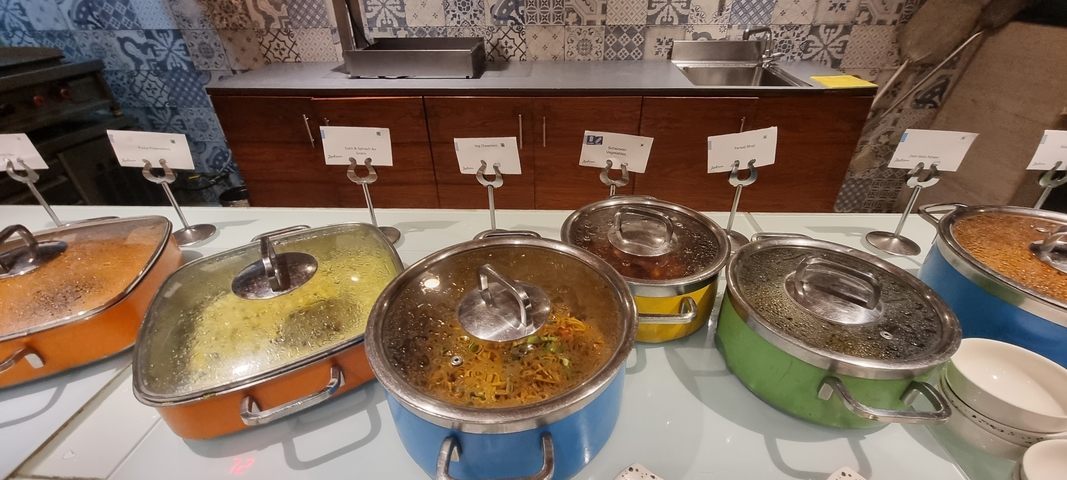       Buffet setup with various food items in a restaurant.
  