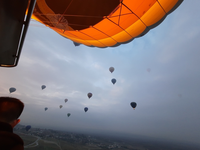       Hot air balloons floating in the sky at Cappadocia.
  