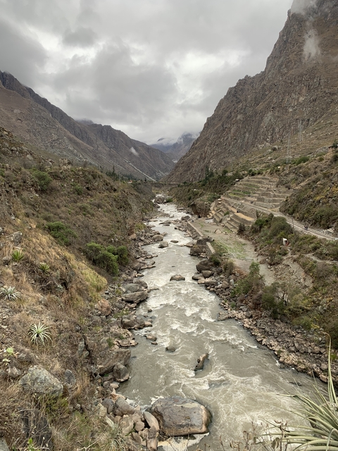       Fast-flowing river through a rocky landscape.
  