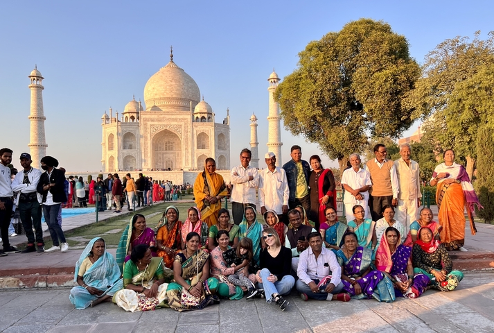 Large group of people in front of the Taj Mahal.
