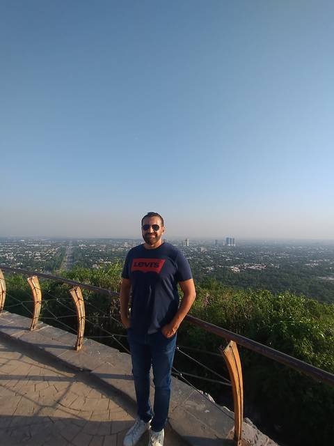 Person on a high lookout with city view.