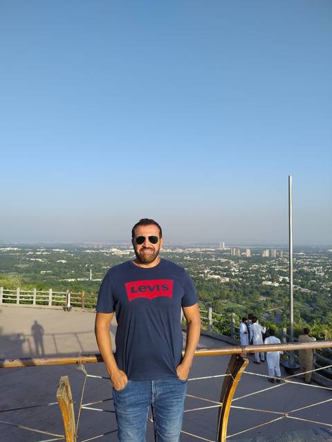       Person with cityscape view from a high vantage point.
  