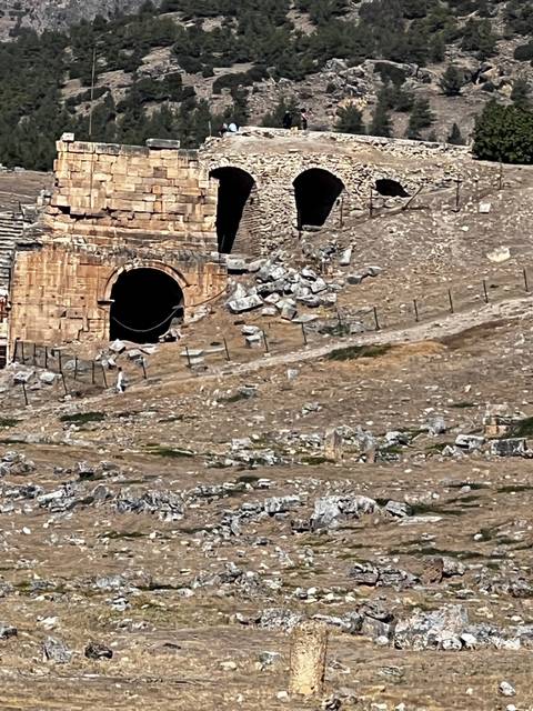       Ancient ruins with large archways and stone structures.
  