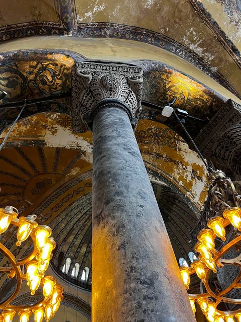       A richly decorated interior with columns and arches.
  