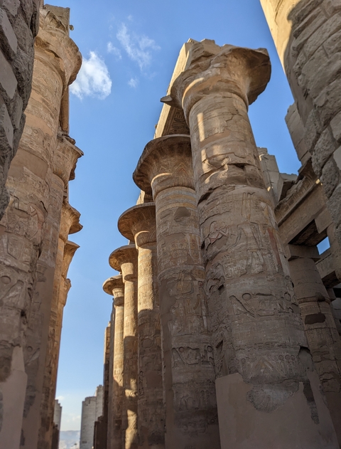 Close-up of intricately carved ancient stone columns.