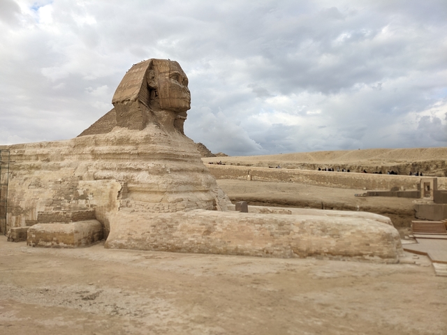 The Great Sphinx of Giza in an open landscape setting.