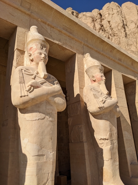 Two large statues of ancient Egyptian kings.