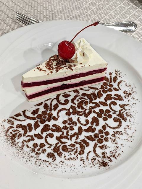 Slice of layered dessert on a plate.