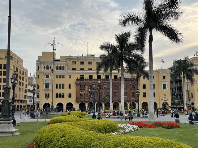 Busy city square with colonial architecture
