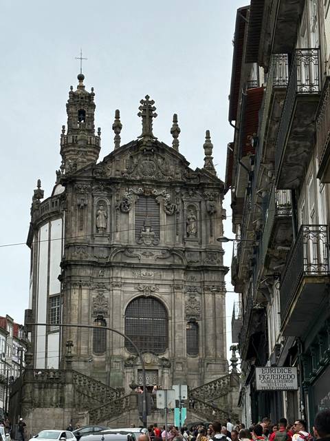 A baroque church facade with intricate details in a city.