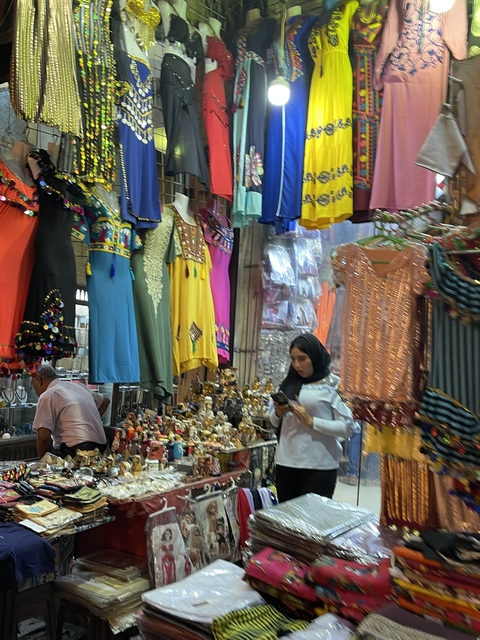 Interior of a colorful clothing and souvenir shop.