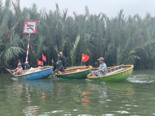       Traditional basket boats on a river.
  