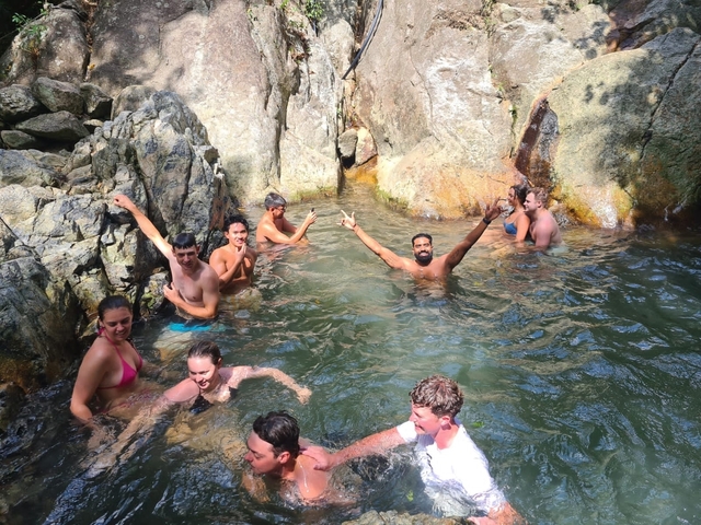 People enjoying in a rocky natural pool.