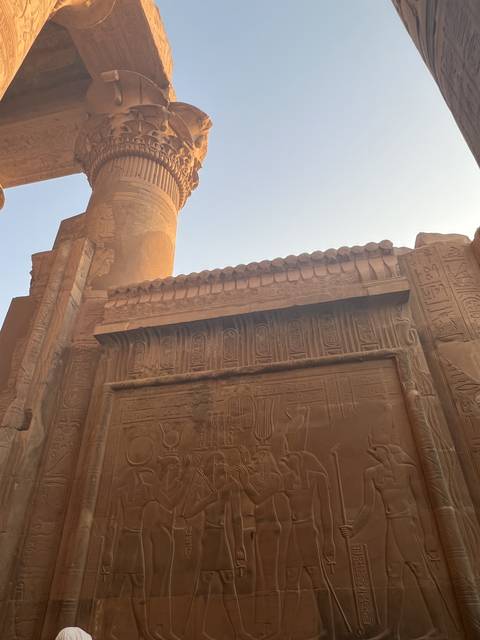Ancient hieroglyphics on a large stone column.