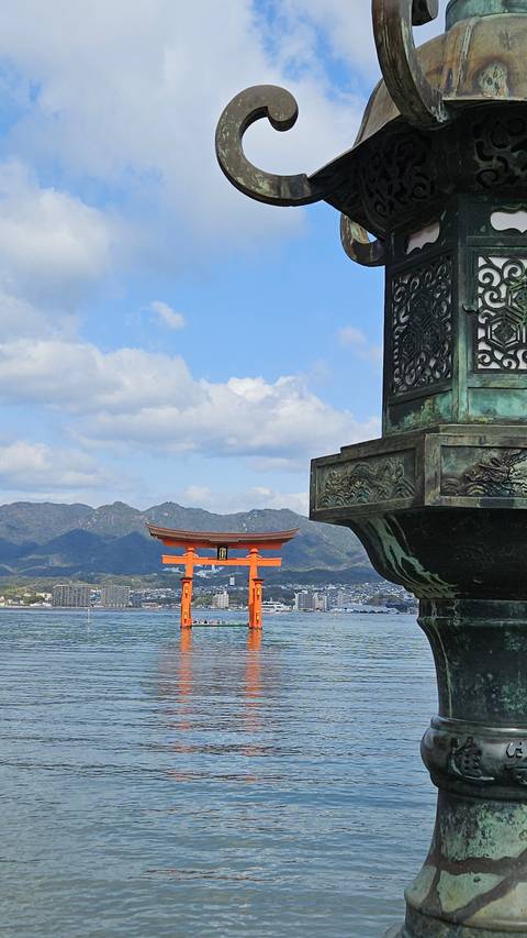 Traditional Japanese torii gate in water.