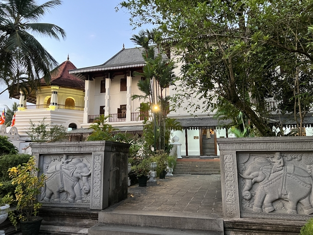 Traditional building with a modern touch and lush surroundings.