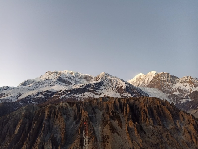 Snow-capped mountains under a clear sky.