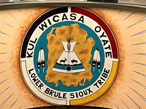 Seal with text in a circular design.