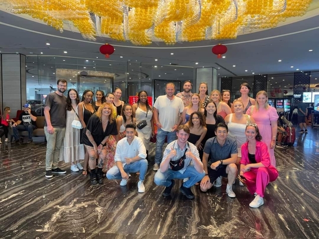 Large group of people in an indoor setting.