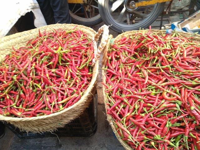       Baskets filled with red chili peppers.
  