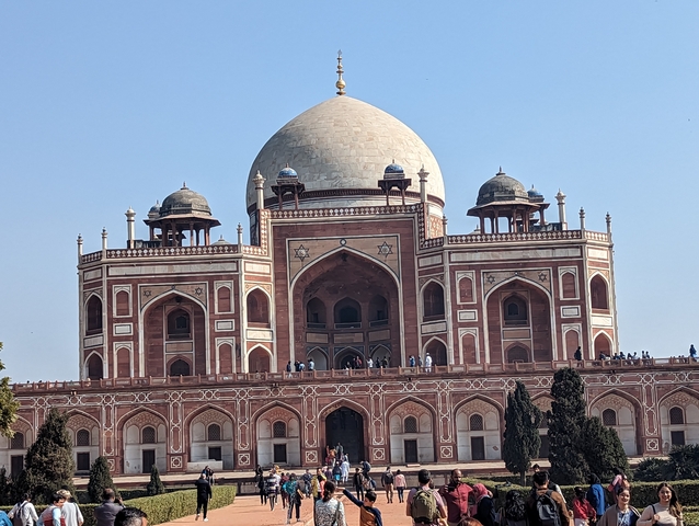 Humayun's Tomb with visitors around during daylight.
