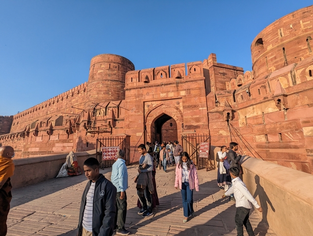       Red Fort entrance with numerous visitors.
  
