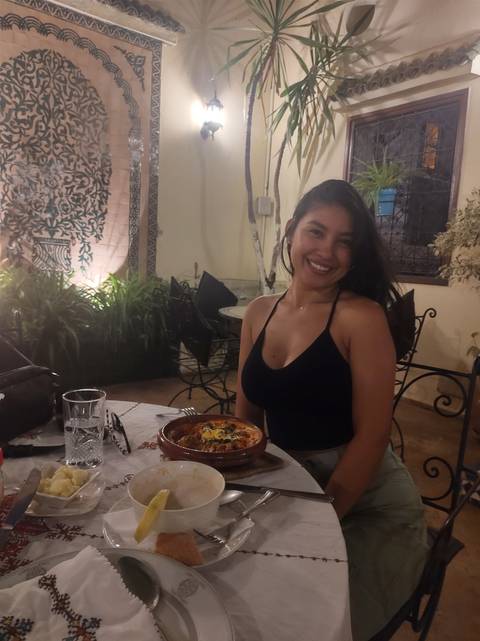 A person dining with traditional Moroccan decor.